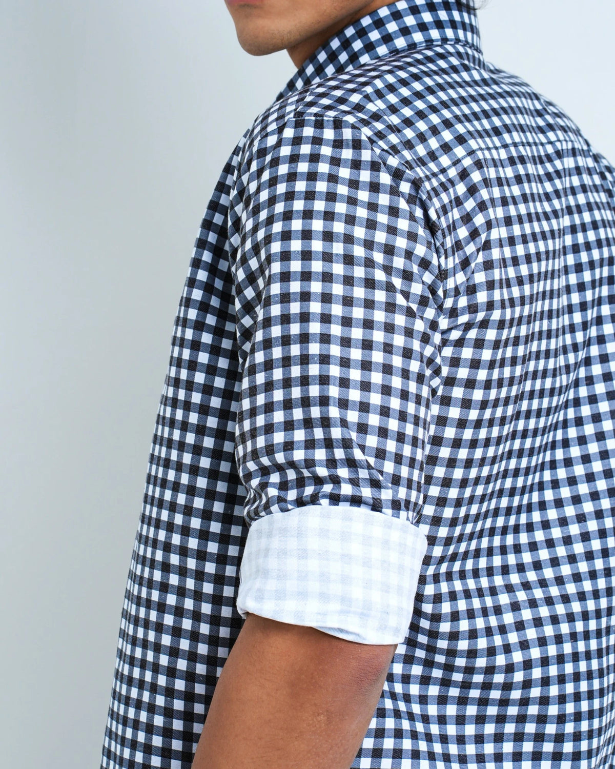 A BLACK AND WHITE CHECKED SHIRT